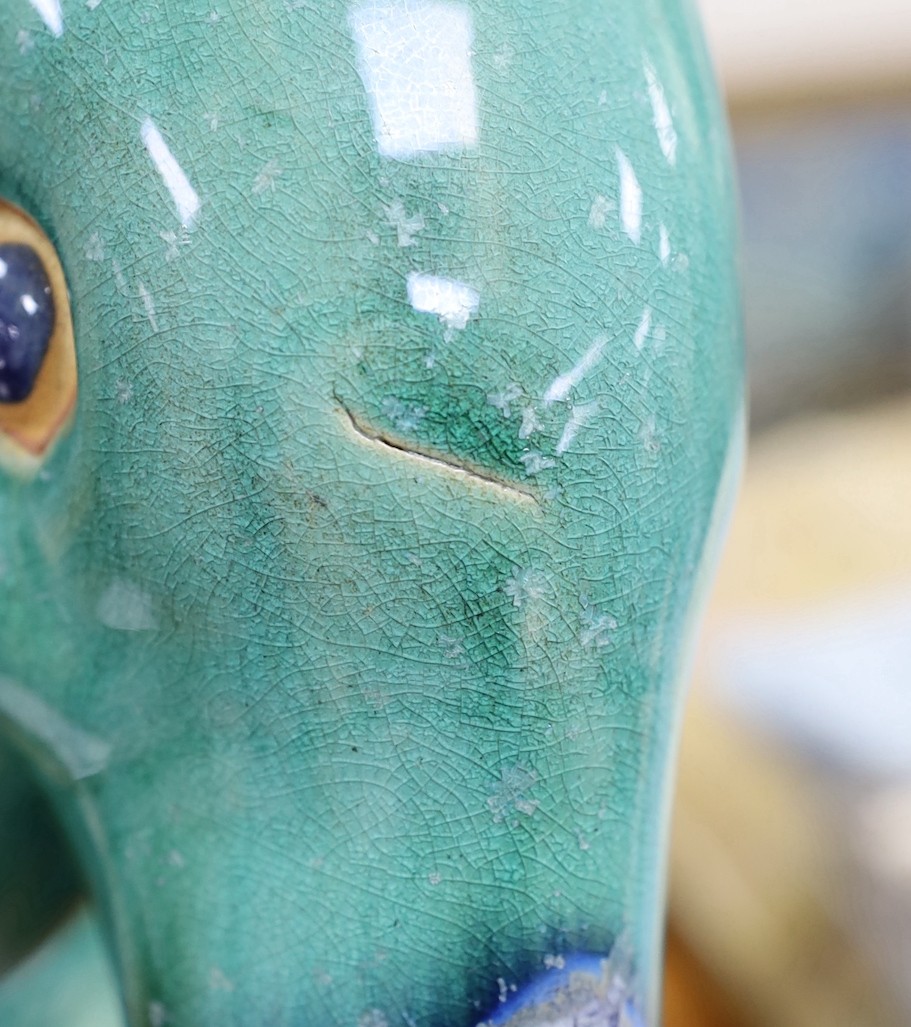 A large Chinese Shiwan style model of a heron, 66cm tall